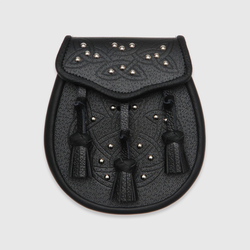 May include: Black leather sporran with a Celtic knot design and silver studs. The sporran has three tassels.