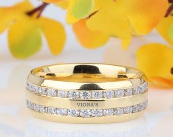 May include: A gold band ring with two rows of small clear stones and the inscription "VIONA'S" on the top.