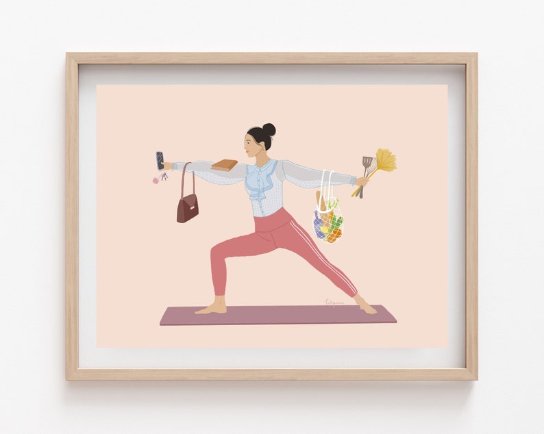 May include: A woman in a blue shirt and pink pants is doing a yoga pose. She is holding a phone in one hand, a purse in the other, and a bag of groceries in her other hand. She is standing on a purple yoga mat.