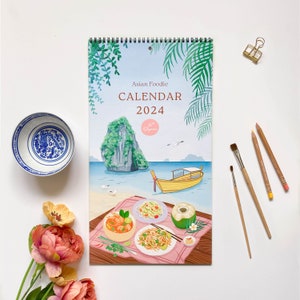 Best wall calendar 2024 featuring beautiful colorful pastel artworks and East and South east asian food illustrations. Best for Christmas, birthday gifts and housewarming. Perfect for travel foodies and cooks to hang in the kitchen as a home decor.