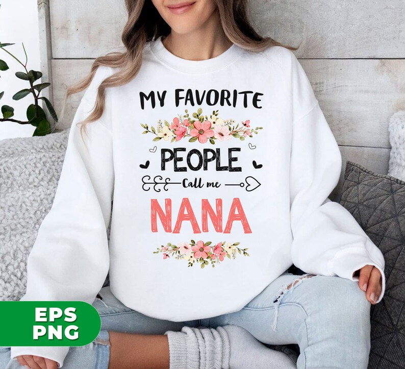 May include: White sweatshirt with pink floral design and the text "My Favorite People Call Me Nana".