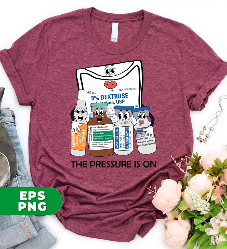 May include: A maroon t-shirt with a cartoon image of a medical IV bag and four vials of medication. The IV bag has a face and the vials have faces. The text "THE PRESSURE IS ON" is printed below the image.