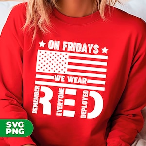 May include: Red sweatshirt with a white American flag and the text "On Fridays We Wear Red" with the word "Red" spelled out vertically with the words "Remember", "Everyone", and "Deployed" written vertically around the word "Red".