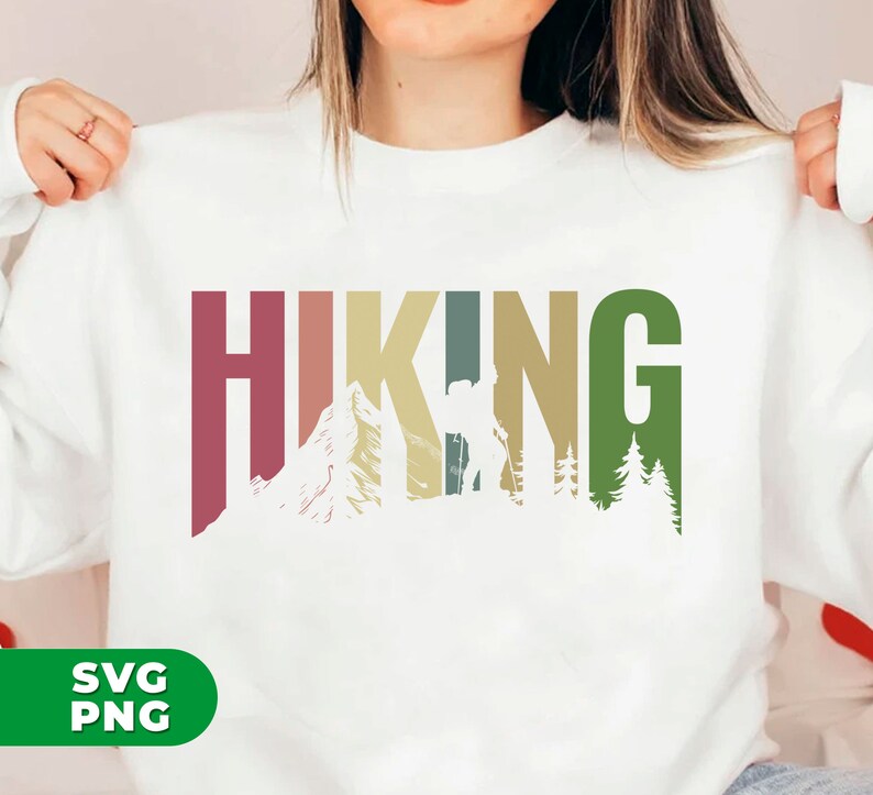 May include: White sweatshirt with a colorful graphic design that says "HIKING" with a silhouette of a hiker, mountains, and trees.