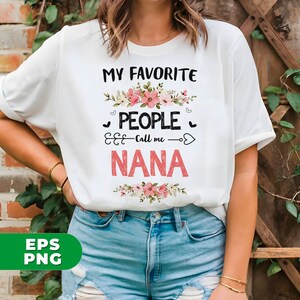May include: White t-shirt with the text "My Favorite People Call Me Nana" in black with pink floral accents.