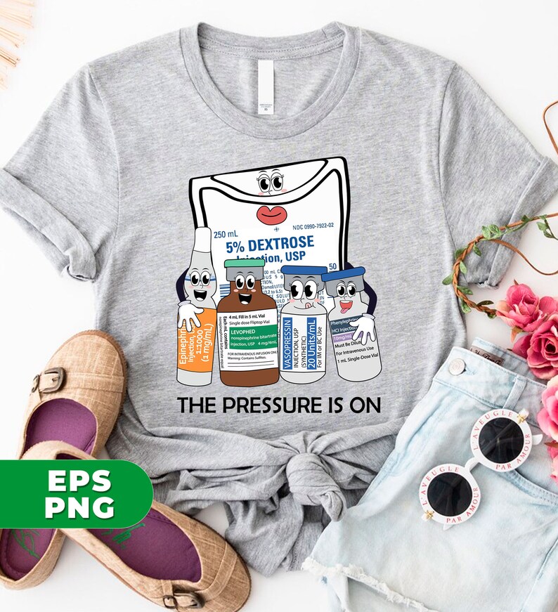 May include: A gray t-shirt with a graphic of a cartoon IV bag and four vials. The IV bag has a face and says "5% Dextrose Solution, USP". The vials also have faces and say "Epinephrine", "Levophed", "Vasopressin", and "NaCl Injection". The text "The Pressure Is On" is printed below the graphic.