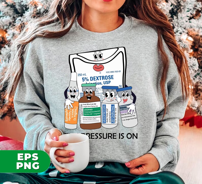 May include: Gray sweatshirt with a graphic of a medical IV bag and three vials with cartoon faces. The text "PRESSURE IS ON" is printed below the graphic.