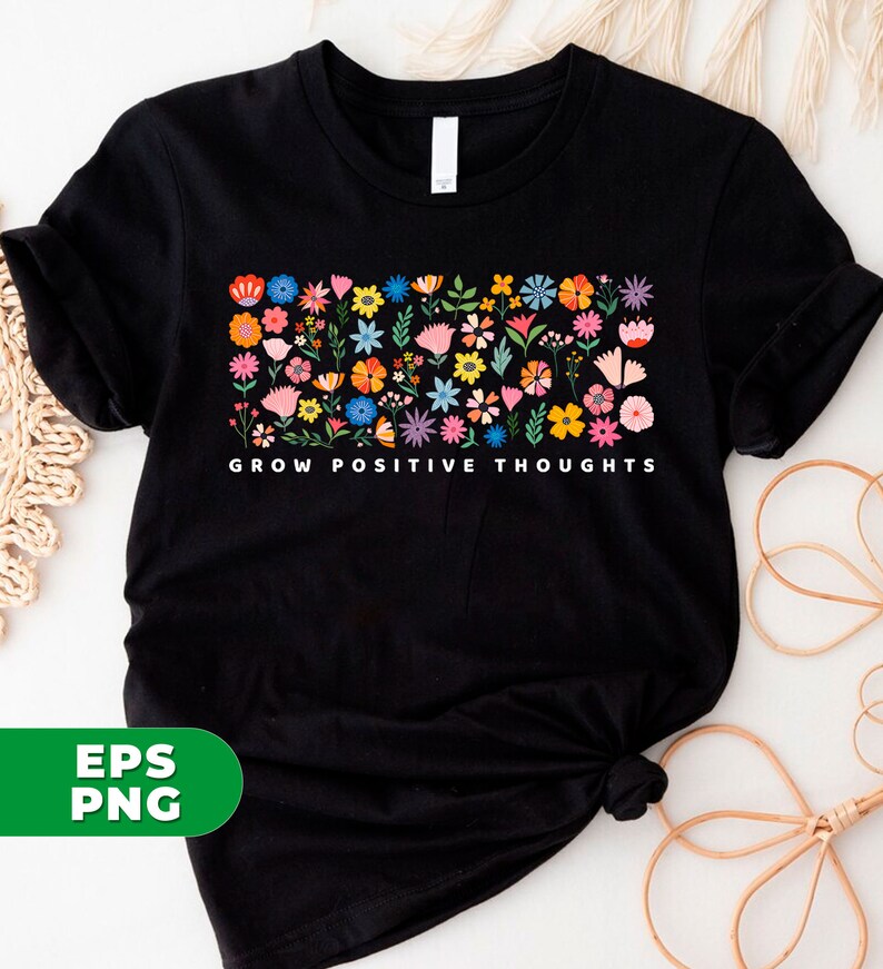 May include: Black t-shirt with a colorful floral design and the text "GROW POSITIVE THOUGHTS" printed on the front.