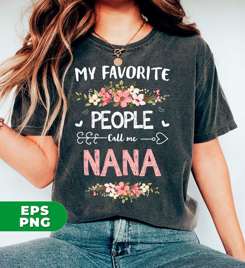 May include: A gray t-shirt with the text "My Favorite People Call Me Nana" in pink and white lettering. The text is surrounded by a floral design with pink and white flowers.