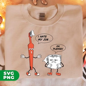 May include: A beige sweatshirt with a cartoon image of a toothbrush and a roll of toilet paper. The toothbrush is red and has a face with a sad expression. The toilet paper has a face with a grumpy expression. The toothbrush says "I hate my job..." and the toilet paper says "Oh please!!"