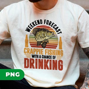 May include: Cream-colored t-shirt with a graphic design. The design features a fish illustration, beer bottles, and text that reads "Weekend Forecast Crappie Fishing with a Chance of Drinking."