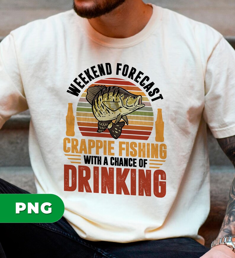 May include: Cream-colored t-shirt with a graphic design. The design features a fish illustration, beer bottles, and text that reads "Weekend Forecast Crappie Fishing with a Chance of Drinking."