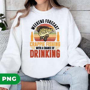 May include: White sweatshirt with a graphic design. The design features the text "Weekend Forecast" above a fish illustration and the words "Crappie Fishing" and "Drinking". The design has a retro color scheme.