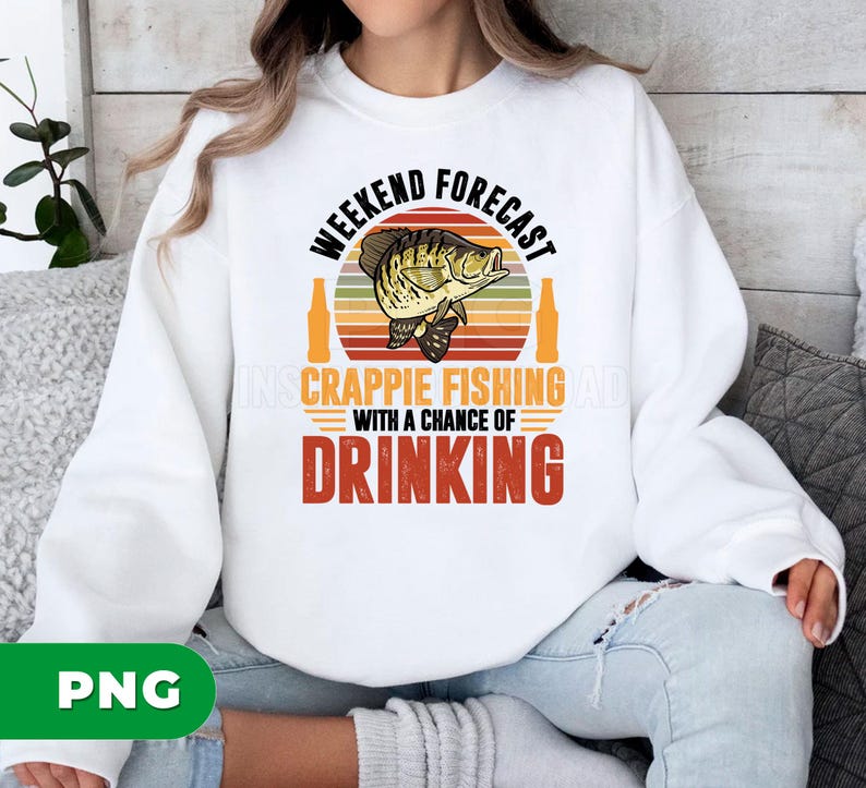May include: White sweatshirt with a graphic design. The design features the text "Weekend Forecast" above a fish illustration and the words "Crappie Fishing" and "Drinking". The design has a retro color scheme.
