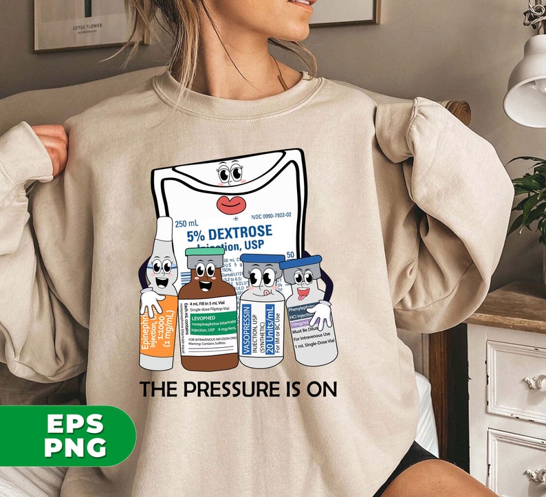 May include: A beige sweatshirt with a graphic of a cartoon IV bag and four vials of medication. The text "THE PRESSURE IS ON" is printed below the graphic.