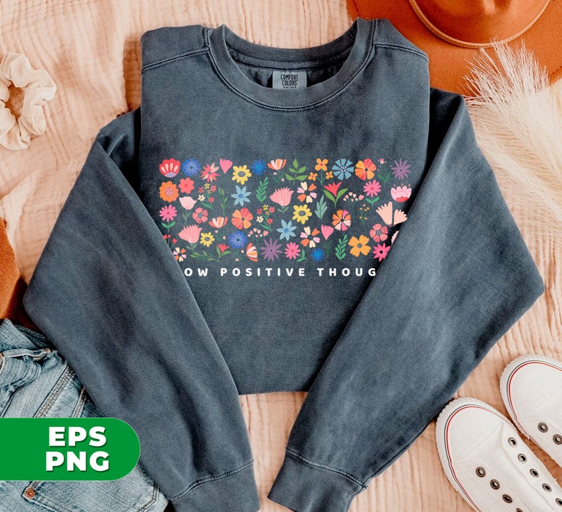 May include: A dark gray sweatshirt with a colorful floral design and the text "Grow Positive Though" printed on the front.