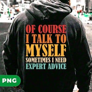 May include: Black hoodie with the text "OF COURSE I TALK TO MYSELF SOMETIMES I NEED EXPERT ADVICE" in red, orange, yellow, and blue lettering. The hoodie is worn by a person, with the back of the hoodie facing the camera.