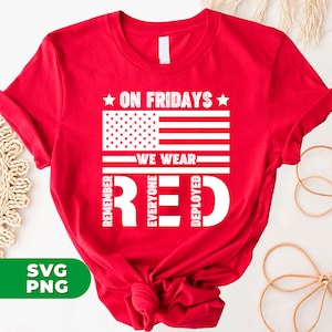 May include: Red, white, and blue American flag design on a red t-shirt. The text reads "On Fridays We Wear Red" with the word "Red" spelled vertically with the letters "R", "E", and "D" each representing "Remember Everyone Deployed".