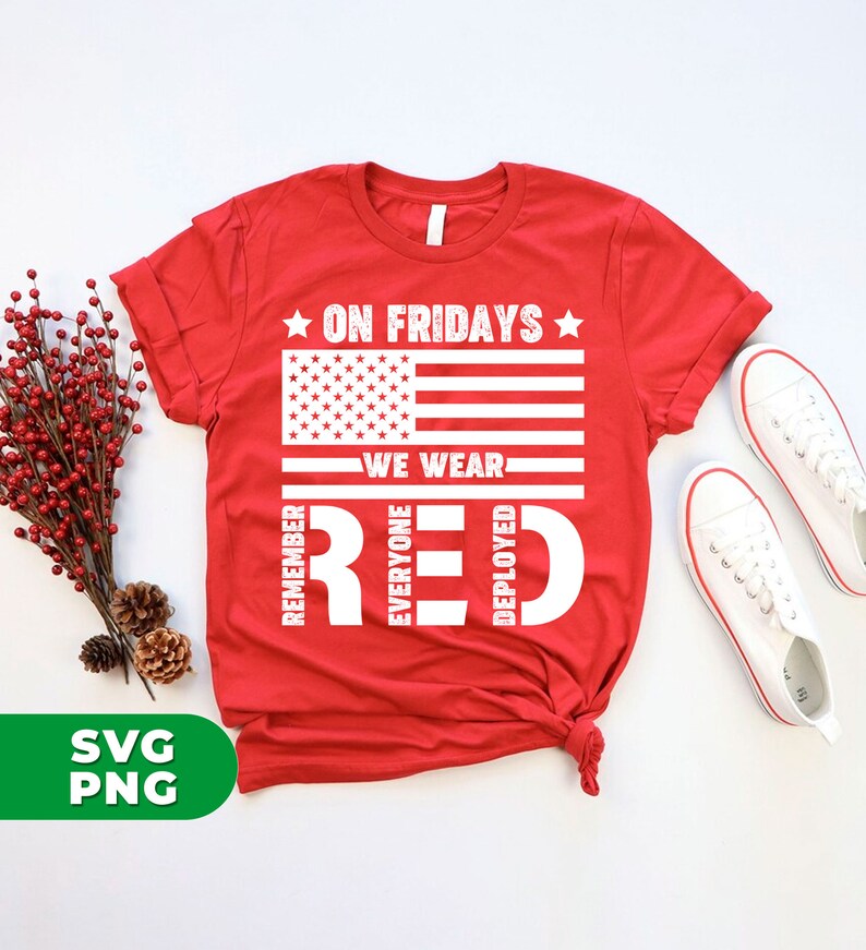 May include: Red t-shirt with a white American flag and the text "On Fridays We Wear Red" with the letters of "Red" spelled out vertically with the words "Remember Everyone Deployed" around the letters.