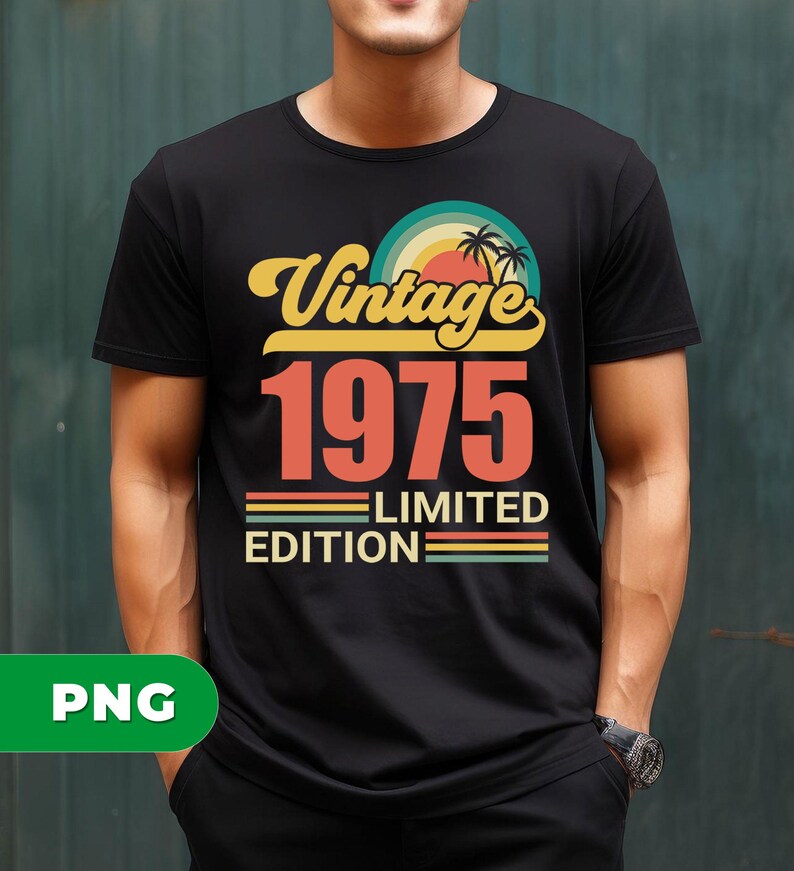 May include: Black t-shirt with a retro design. The design features the text "Vintage 1975 Limited Edition" in yellow and orange, with a sunset and palm tree graphic. The shirt is a crew neck.