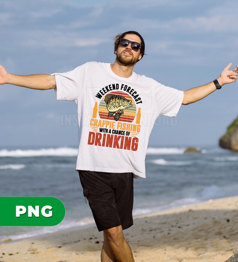 May include: White t-shirt with the text "Weekend Forecast Crappie Fishing with a Chance of Drinking" in a retro design. The shirt features a fish graphic and beer bottles. The person is wearing black shorts and a black beanie.