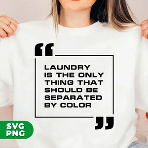 May include: White sweatshirt with black text that reads "Laundry is the only thing that should be separated by color" in quotation marks.