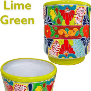 May include: Two lime green ceramic planters with colorful floral designs. The planters are decorated with bright red, yellow, blue, and green flowers and leaves. The text "Lime Green" is written in white letters on a white background.