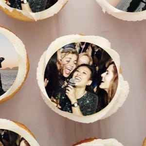 May include: A set of six round cupcakes with edible images of friends celebrating. The images include a group of friends singing karaoke, a group of friends silhouetted on a beach, and a group of friends raising their arms in the air on a beach.