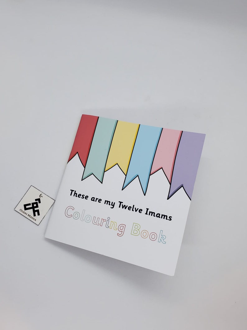 May include: A white coloring book with a rainbow of flags at the top and the text "These are my Twelve Imams Coloring Book".