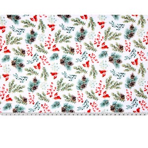 May include: White fabric with a repeating pattern of green pine needles, brown pine cones, red berries, and small white flowers. The design is a festive, winter holiday theme. A ruler is at the bottom of the image.