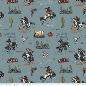 May include: A blue and white fabric with a repeating pattern of cowboys riding horses, cacti, and saloon signs. The text "John Wayne" and "Saloon" are repeated throughout the pattern.