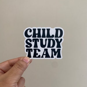 May include: Black and white sticker with the text "CHILD STUDY TEAM" in a retro font.
