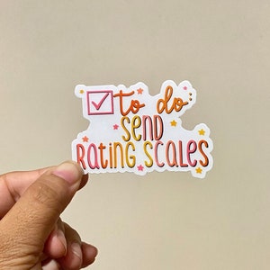 May include: A white sticker with a pink checkmark in a box and the text "to do: send rating scales" in orange and pink lettering with yellow stars.