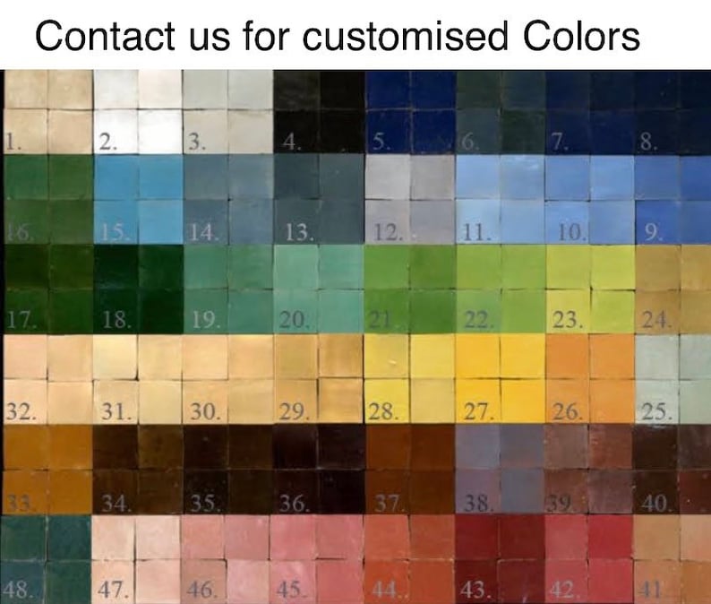 May include: A color chart with 48 small square tiles, each a different shade of color. The tiles are arranged in rows and columns, and each tile is numbered. The colors range from light to dark, and include shades of blue, green, yellow, brown, and red.