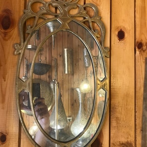 Handmade Moroccan brass mirror. Hand-engraved mirror. Can be hung on any room of the house. Mirror engraved with the ma