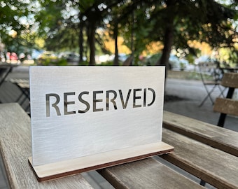 Reserved stand, Cafe table sign, Restaurant reservation, Silver reserved sign on a wooden base