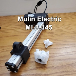 May include: A silver and black electric linear actuator with a black motor and a silver rod. The actuator is labeled "Mulin Electric ML8-145". There are two white plastic brackets included.