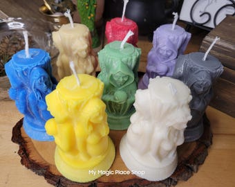May include: Assortment of nine colorful candles, each featuring a different figure in a hooded robe. The candles are arranged on a wooden surface and are all approximately 4 inches tall.  My Magic Place Shop is printed on the surface.