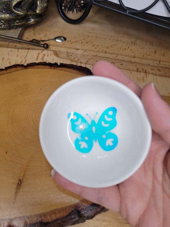 A hand-sculpted ceramic butterfly dish that doubles as a jewelry holder — tiny, whimsical, and clearly made by hand.