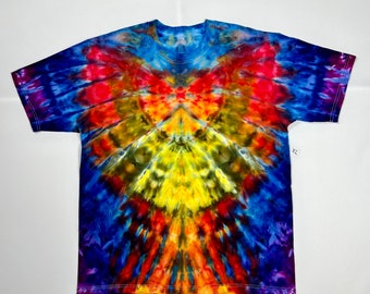 May include: A tie-dye t-shirt with a vibrant color scheme, featuring shades of blue, purple, red, orange, yellow, and green. The shirt has a symmetrical design with a central yellow area and radiating colors.