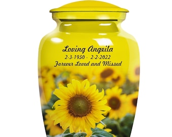 May include: Yellow ceramic urn with a sunflower field design. The urn has the text "Loving Angelea 2-3-1950 - 2-2-2022 Forever Loved and Missed" on the front.