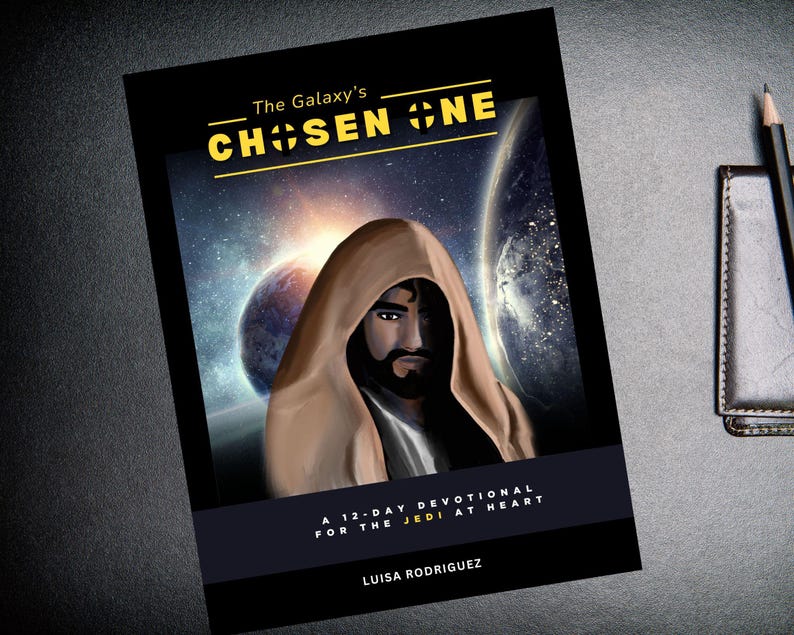 May include: A book cover with a dark background and a galaxy scene. The title is "The Galaxy's Chosen One" in yellow letters. The subtitle is "A 12-Day Devotional for the Jedi at Heart" in white letters. The author's name is "Luisa Rodriguez" in white letters.