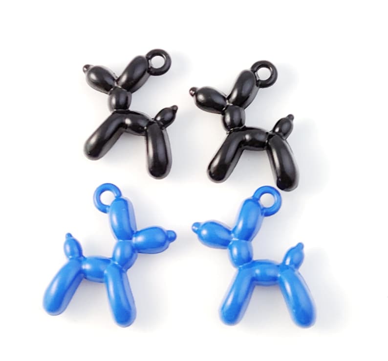 May include: Four balloon dog charms, two black and two blue. The charms are made of plastic and have a loop for attaching to a necklace or bracelet.