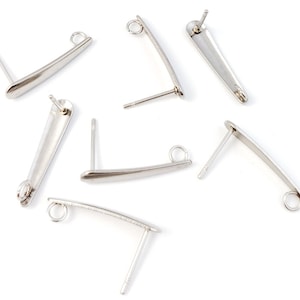 May include: Silver earring findings with a loop at the top and a post at the bottom. The findings are designed to be used with a variety of earring styles.