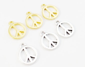 May include: Six peace sign charms, three silver and three gold, with a loop for attaching to jewellery or other crafts.