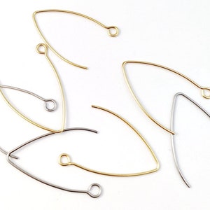 May include: A set of five earring findings, two are gold and three are silver. The findings are shaped like a teardrop with a small loop at the top.