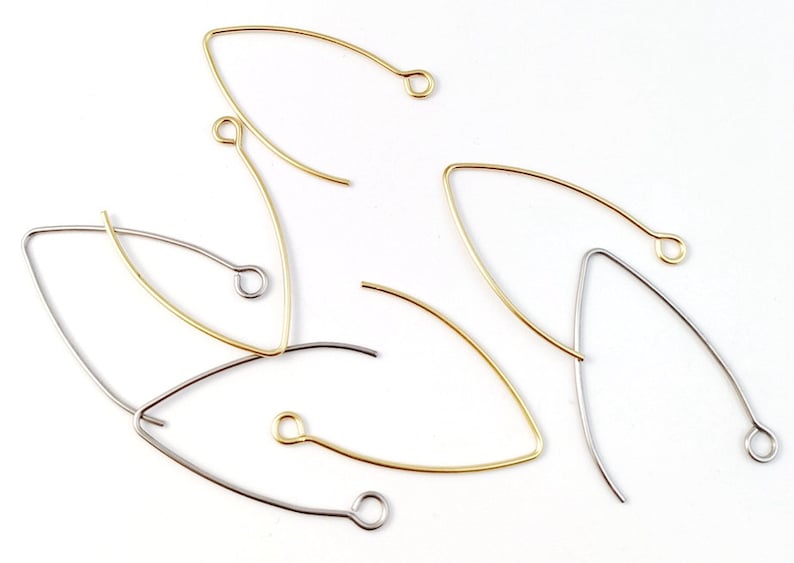 May include: A set of five earring findings, two are gold and three are silver. The findings are shaped like a teardrop with a small loop at the top.