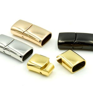 May include: Four magnetic clasps for jewelry making. The clasps are made of metal and come in four finishes: silver, gold, rose gold, and black.