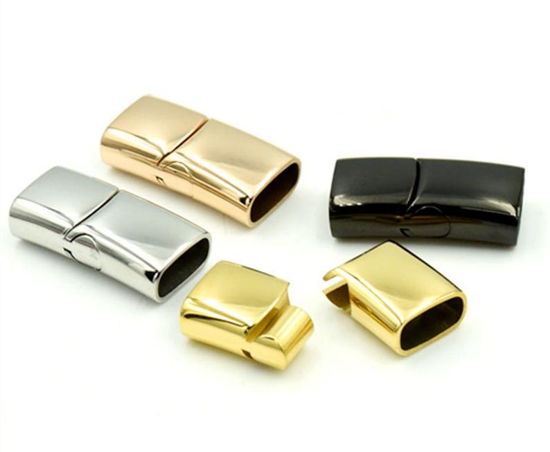 May include: Four magnetic clasps for jewelry making. The clasps are made of metal and come in four finishes: silver, gold, rose gold, and black.