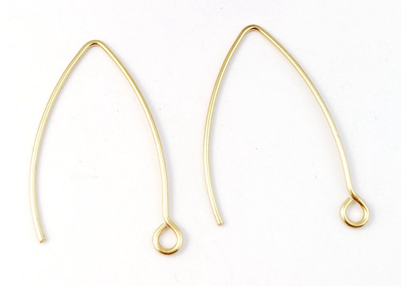 May include: Two gold-colored earring hooks with a small loop at the end.